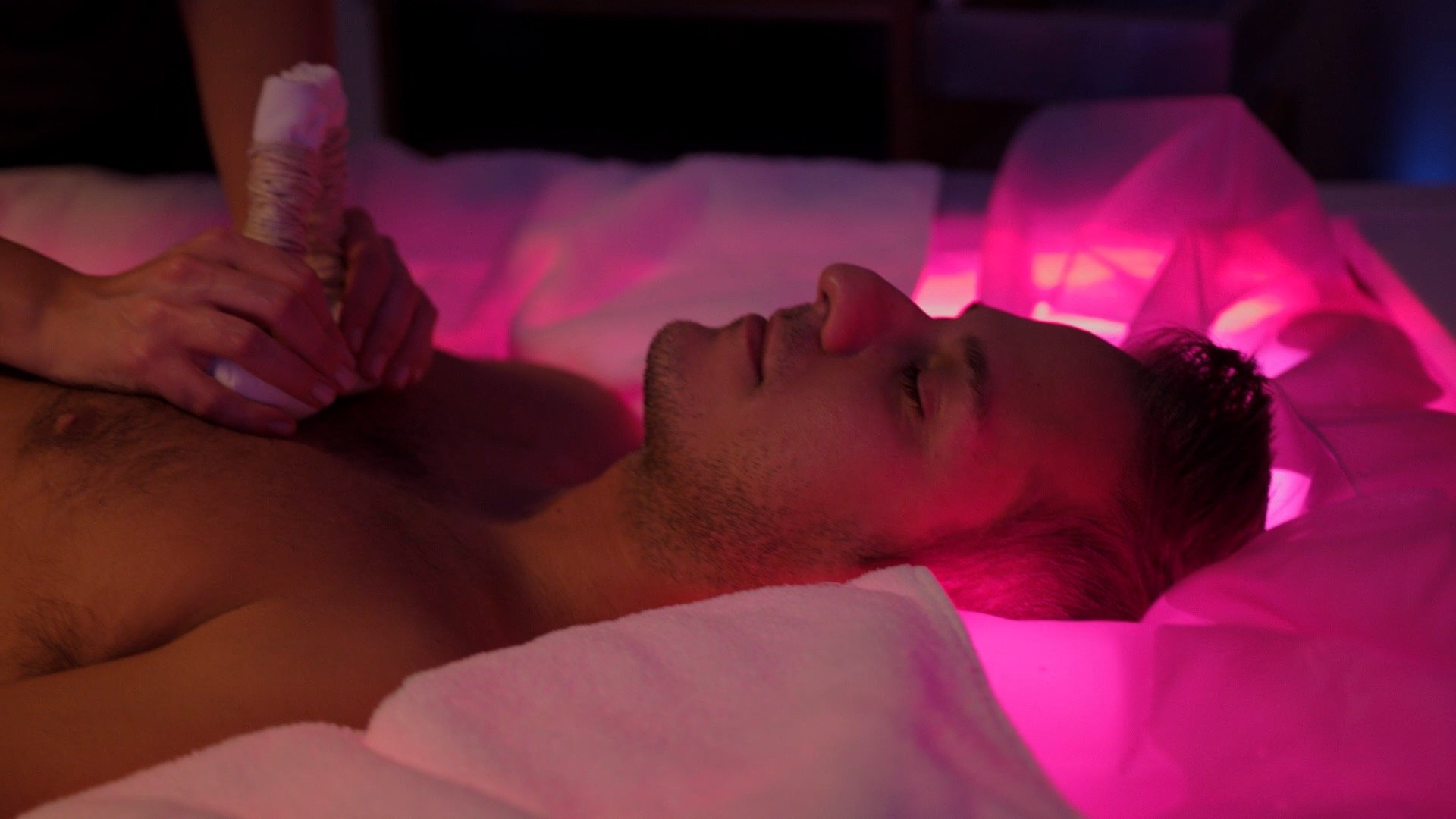 A holiday near Assisi: activities galore Man lying down with eyes closed receiving herbal massage