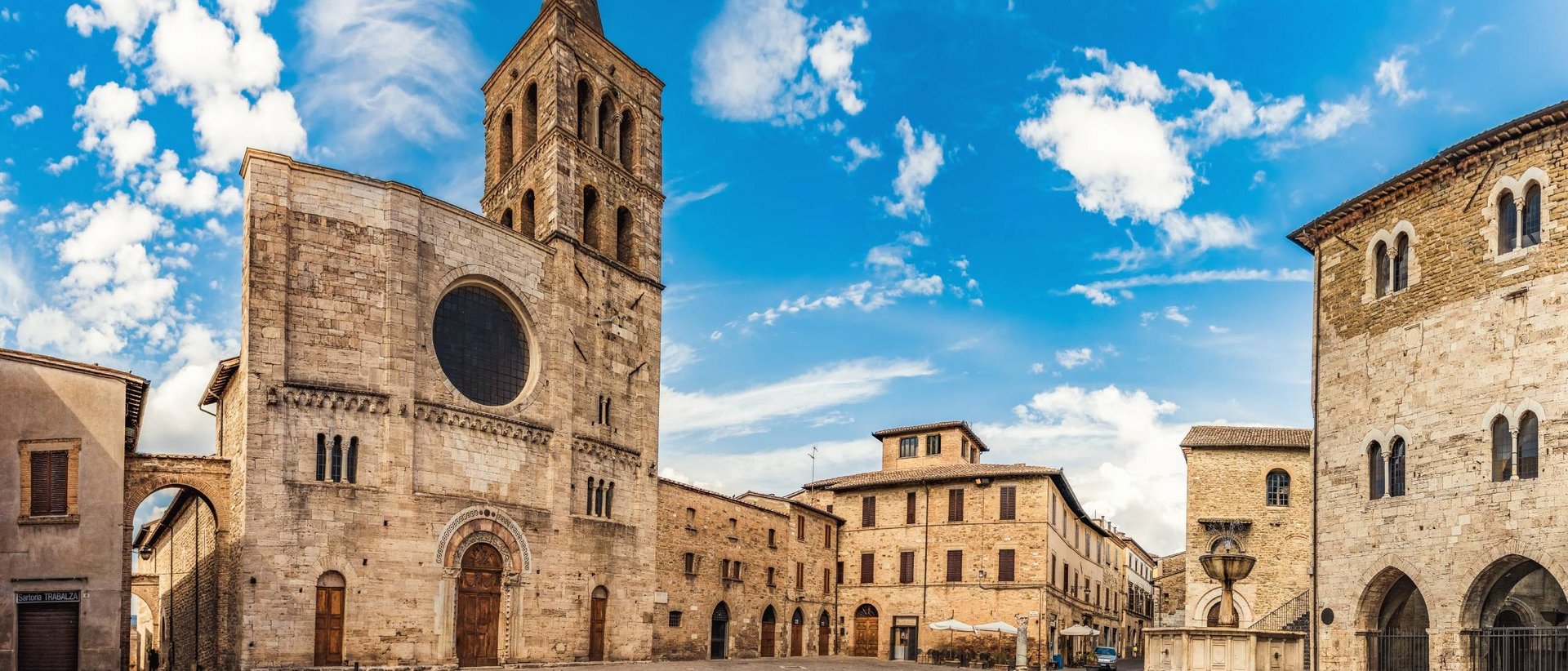 Basilica of Saint Francis of Assisi Historic square with church and fountain under clear sky